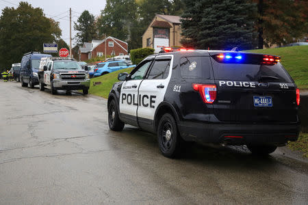 Police vehicles are deployed near the vicinity of the home of Pittsburgh synagogue shooting suspect Robert Bowers' home in Baldwin borough, suburb of Pittsburgh, Pennsylvania, U.S., October 27, 2018. REUTERS/John Altdorfer 