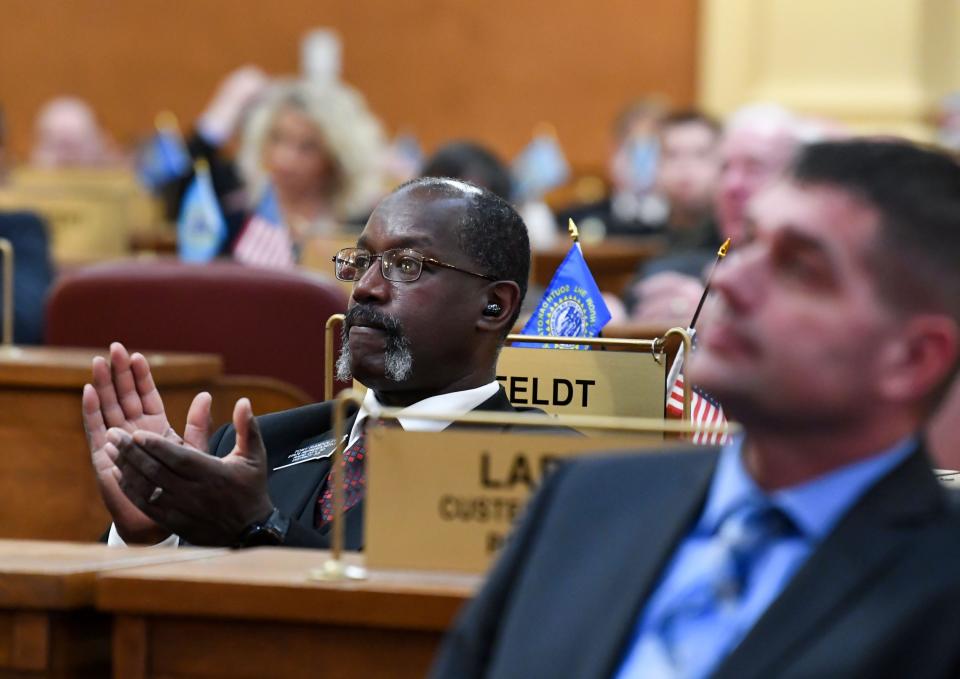 Tony Randolph applauds during Governor Kristi Noem’s annual budget address on Tuesday, December 6, 2022, at the South Dakota State Capitol in Pierre.