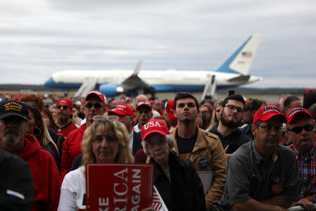 Air Force One can be seen on the tarmac as supporters rally with U.S. President Donald Trump at Middle Georgia Regional Airport in Macon, Georgia, U.S. November 4, 2018. REUTERS/Jonathan Ernst
