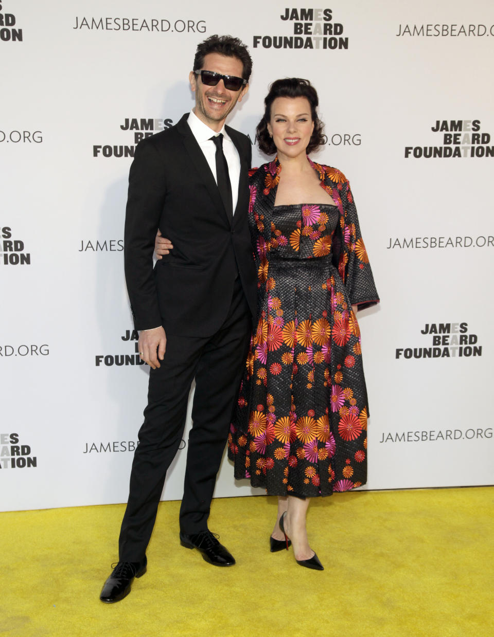 Television personality Gabriele Corcos, left, and his wife, actress Debi Mazar, right, attend the 2014 James Beard Foundation Awards on Monday, May 5, 2014, in New York. (Photo by Andy Kropa/Invision/AP)