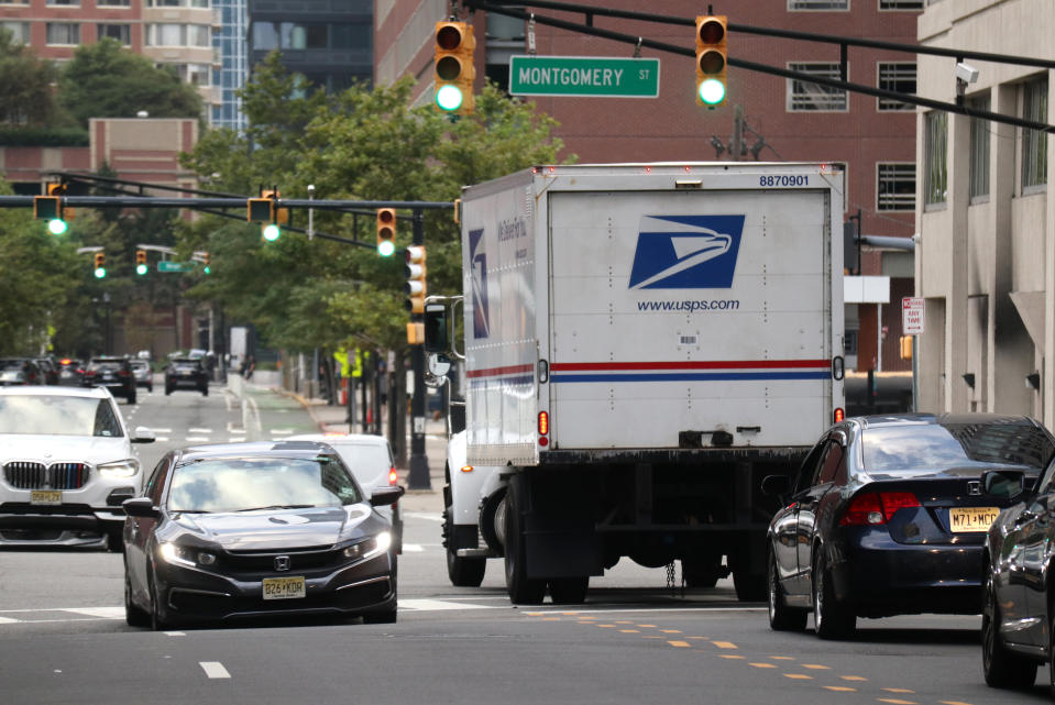 JERSEY CITY, NJ - AUGUST 17: The United States Postal Service (USPS) truck drives outside a post office on August 17, 2020 in Jersey City, New Jersey. (Photo by Gary Hershorn/Getty Images)