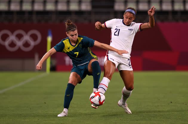 KASHIMA, JAPAN - JULY 27: Steph Catley of Australia battles for possession with Lynn Williams of the United States.  (Photo: Atsushi Tomura via Getty Images)