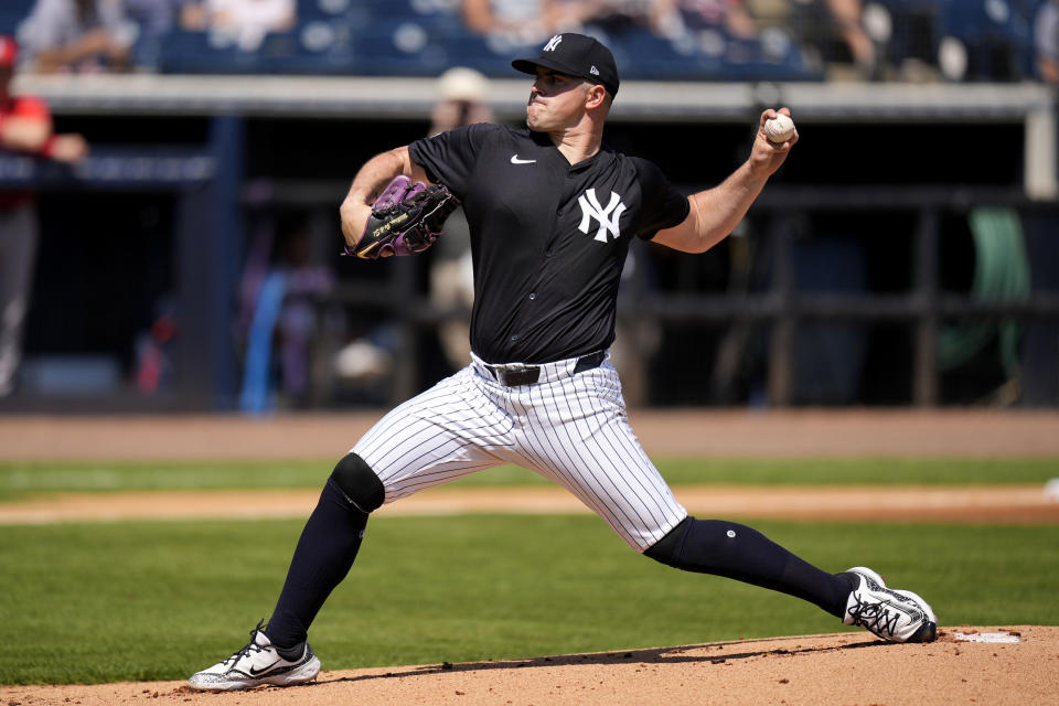 New York Yankees starting pitcher Carlos Rodon throws during the first inning of a spring training baseball game against the Boston Red Sox Wednesday, March 13, 2024, in Tampa, Fla. (AP Photo/Charlie Neibergall)