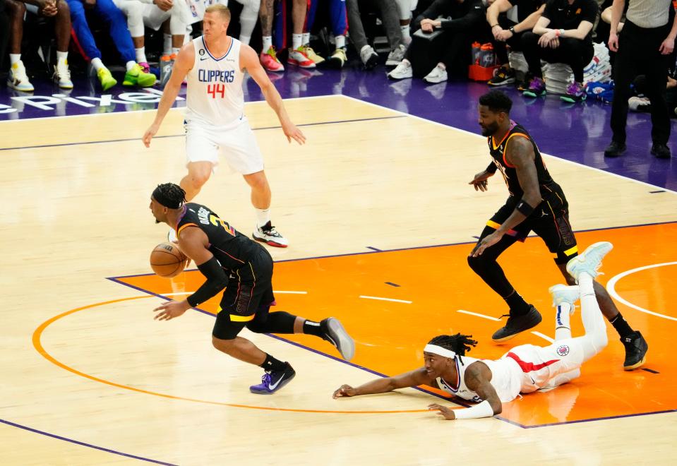 Apr 25, 2023; Phoenix, AZ, USA; Phoenix Suns forward Josh Okogie (2) steals the ball from LA Clippers guard Terance Mann (14) in the second half at Footprint Center. Mandatory Credit: Rob Schumacher-Arizona Republic