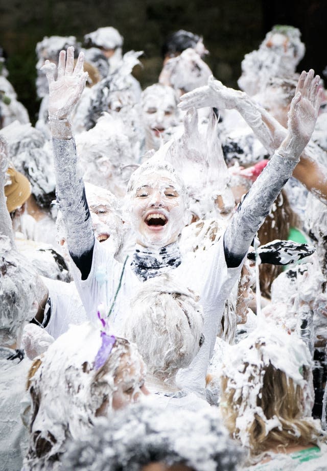 Hundreds of students take part in the traditional Raisin Monday foam fight on St Salvator’s Lower College Lawn at the University of St Andrews in Fife