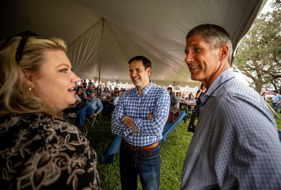 Florida Senator Marco Rubio talks with Congressman Scott Franklin , right and Congresswoman Kat Cammack left during the USDA crop forecast luncheon and  post-Hurricane Ian information meeting at the Putnam El Clair Ranch In Zolfo SpringsFl. Wednesday October 12,2022Ernst Peters/The Ledger