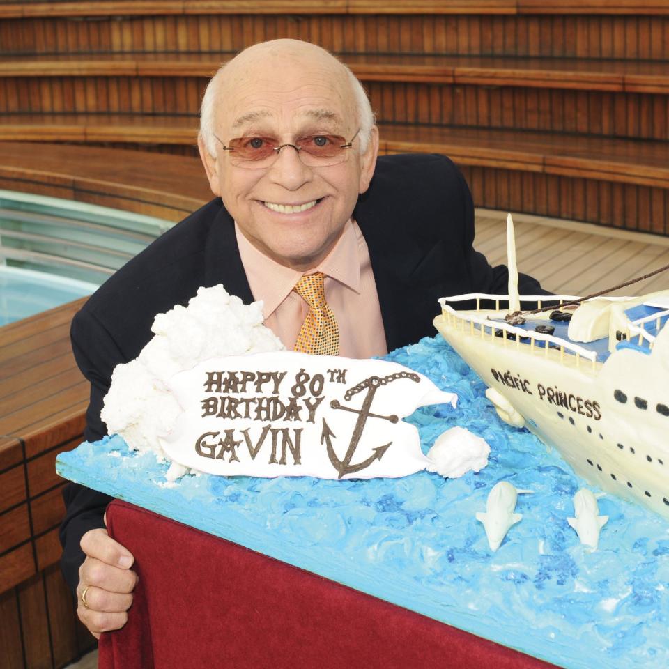 This 2011 photo provided by Princess Cruises shows Gavin MacLeod celebrating his eightieth birthday luncheon aboard the Golden Princess. MacLeod's autobiography, “This is Your Captain Speaking,” will be released Tuesday, Oct. 22, 2013. (AP Photo/Princess Cruises)