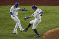 Los Angeles Dodgers' Cody Bellinger celebrates his two-run home run against the Tampa Bay Rays during the fourth inning in Game 1 of the baseball World Series Tuesday, Oct. 20, 2020, in Arlington, Texas. (AP Photo/Sue Ogrocki)