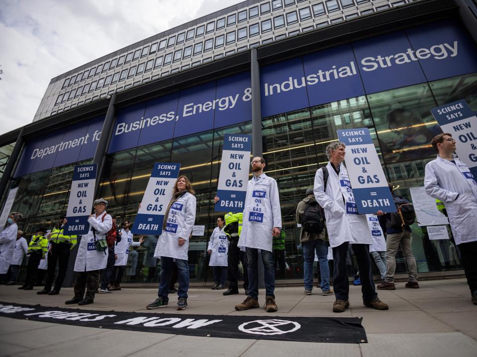 Extinction Rebellion activists protesting outside the Department for Business, Energy, and Industrial Strategy (Getty Images)