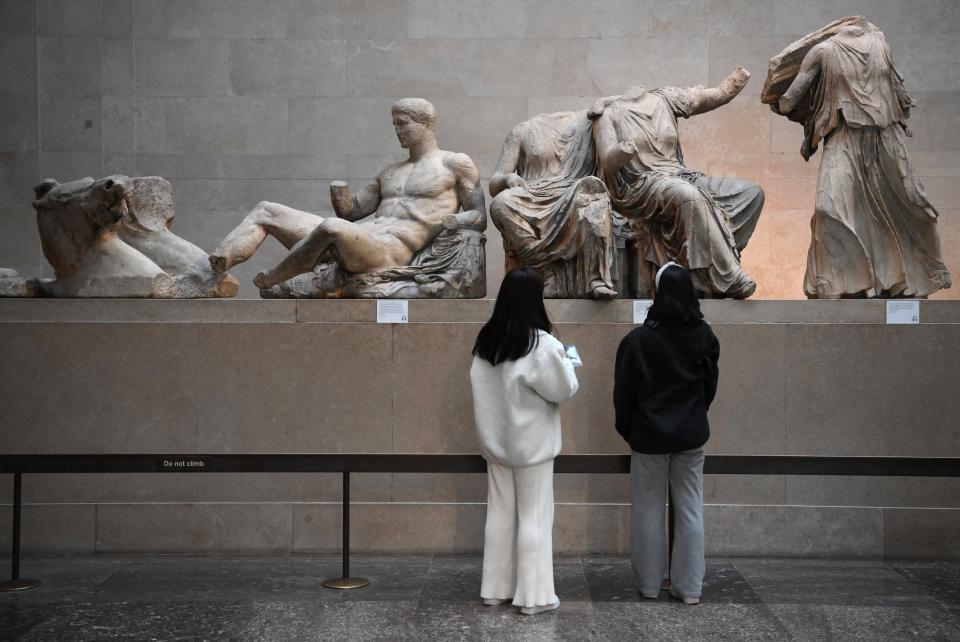 Visitors viewing the Parthenon Marbles, also known as the Elgin Marbles, at the British Museum in London in January (AFP via Getty Images)