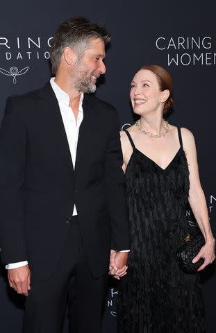 <p>Mike Coppola/Getty </p> Bart Freundlich and Julianne Moore