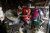 A man blends ginger at a market in Kaduna