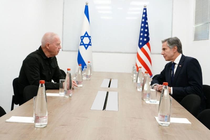 Israeli Defense Minister Yoav Gallant (L) meets with US Secretary of State Antony Blinken during their visit to Nir Oz Kibbutz in Southern Israel. Ariel Hermoni/GPO/dpa
