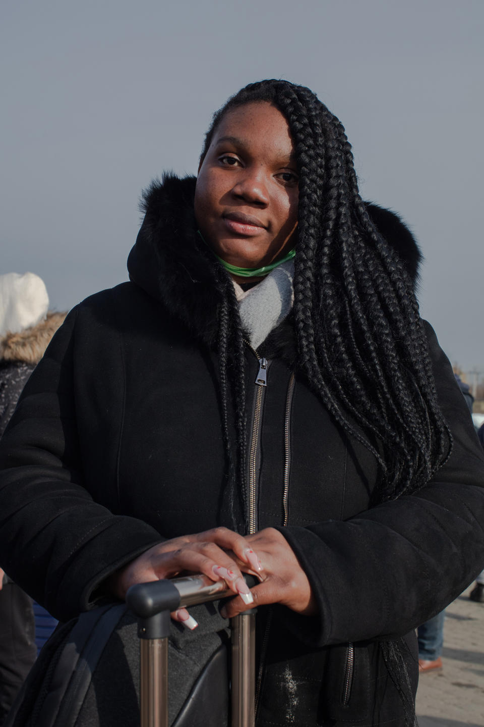 Karen poses for a portrait at the Medyka crossing on March 1. Karen had her nails done for Valentine's Day and couldn’t believe how much has changed since.<span class="copyright">Natalie Keyssar for TIME</span>