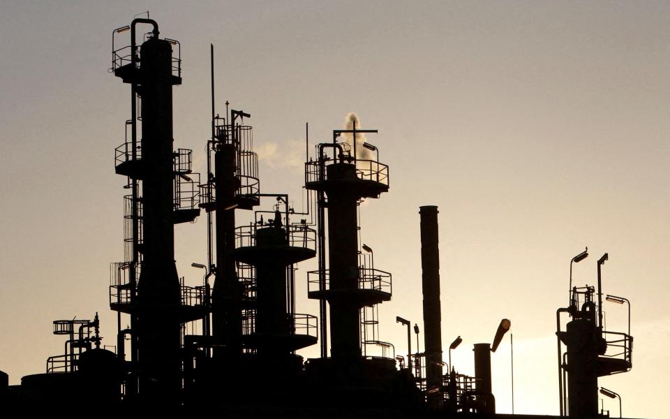 towers of an oil refinery in Melbourne, 2010 - Mick Tsikas/Reuters