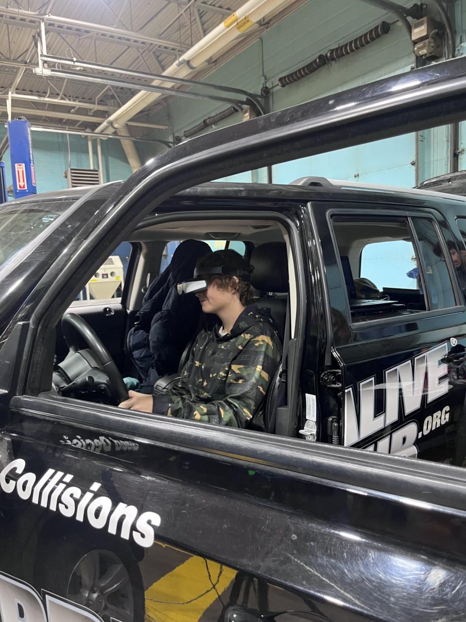 Jefferson High School student Gavin Anteau tries out the Arrive Alive simulator.