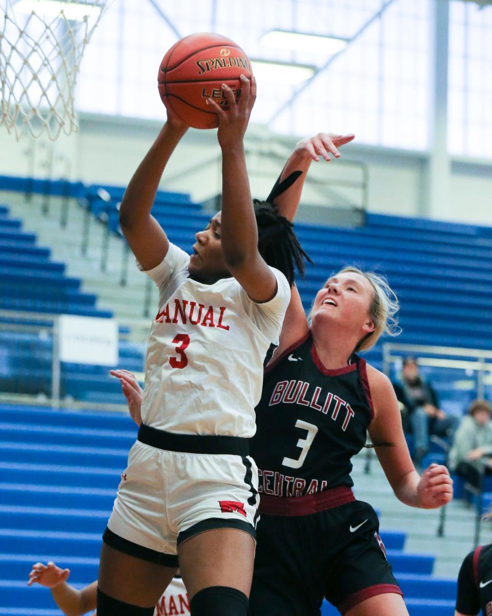 Manual’s Jakayla Thompson (3) grabs a rebound against Bullitt Central’s Kylee Wheatley (3) during the Girls LIT at the Valley High School gym in Louisville, Ky. on Jan. 25, 2023.  