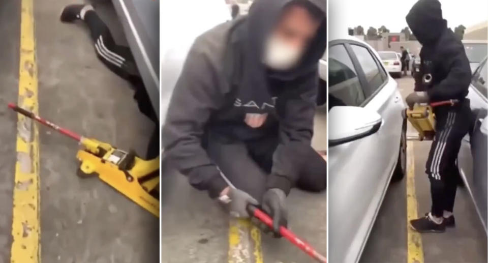 An alleged thief is spotted underneath a car at Bankstown Central shopping centre.