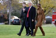 <p>Melania was photographed in camel suede from head to toe leaving the White House in late November 2019. Both the slouchy boots and coat are by Burberry.</p>