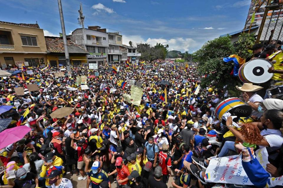 Protesters fill the street from side to side