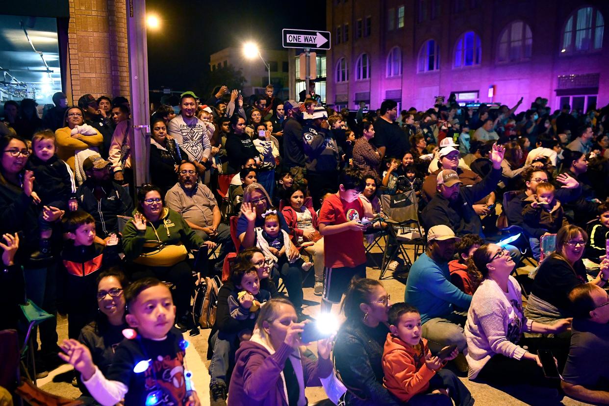 Large crowds lined downtown streets for Tuesday's 33rd Christmas Lights Parade in downtown Abilene.