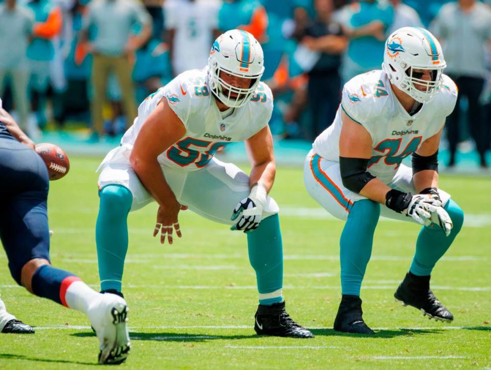 Miami Dolphins offensive tackle Liam Eichenberg (74) blocks as Dolphins guard Connor Williams (58) snap the football during first quarter of an NFL football game at Hard Rock Stadium on Sunday, September 11, 2022 in Miami Gardens, Florida.