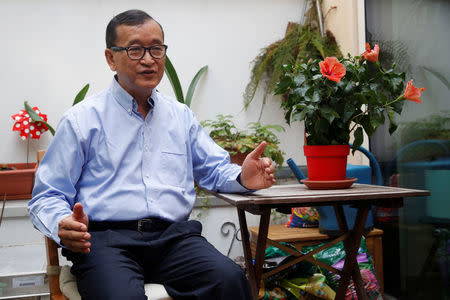 Former president of the dissolved opposition Cambodia National Rescue Party (CNRP) Sam Rainsy, who is living in exile, speaks during an interview with Reuters on his terrace in Paris, France, July 19, 2018. REUTERS/Philippe Wojazer