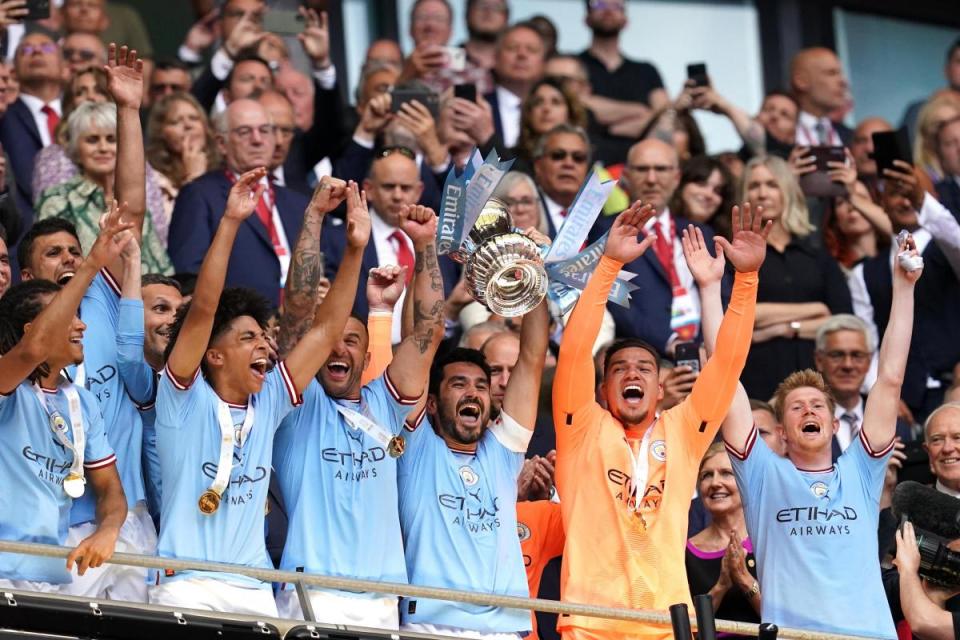 Manchester City's players celebrate after winning last season's FA Cup final <i>(Image: PA)</i>