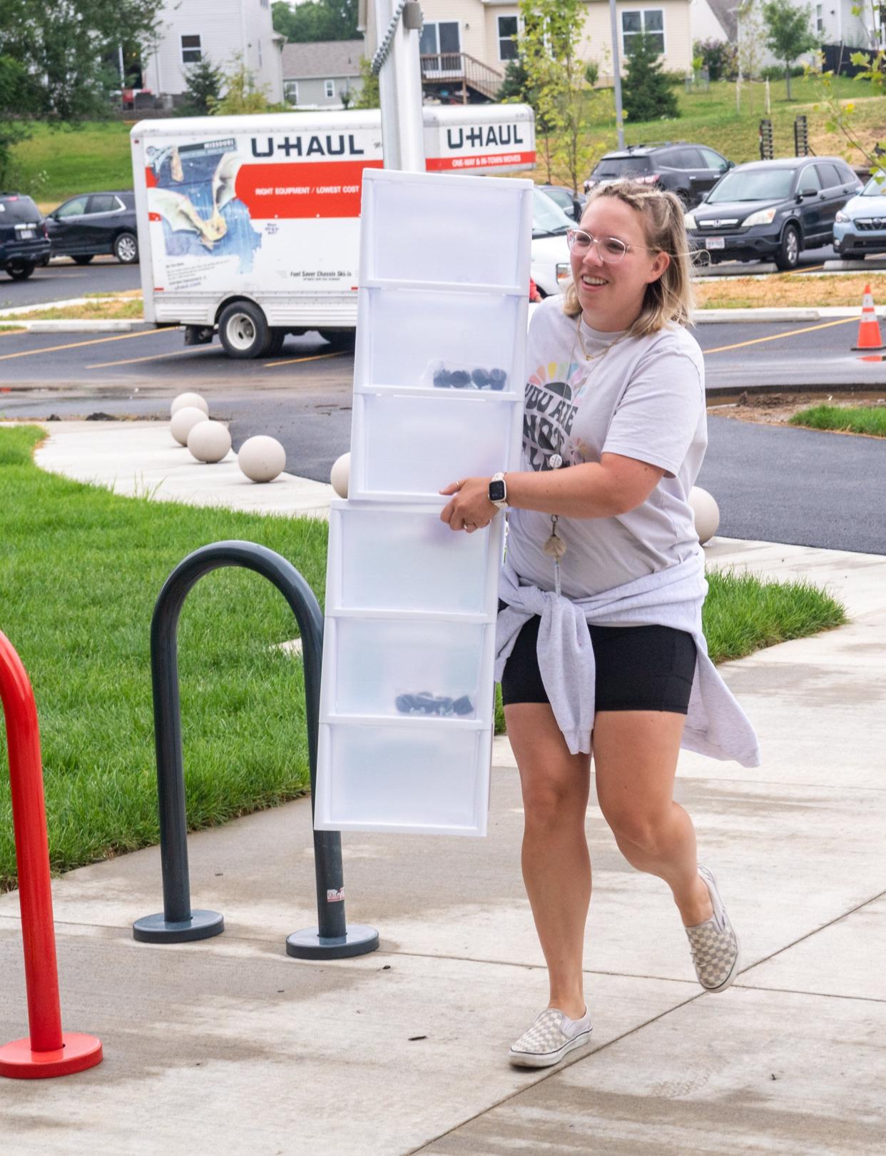 Fourth-grade teacher Caitlin Florek works during move-in day at Minerva France Elementary School on July 18.