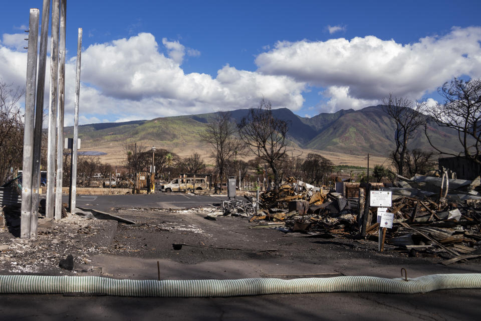 Debris of former shops and businesses on Front Street in burn zone 11A is pictured Dec. 8, 2023, in Lahaina, Hawaii. The area reopened Monday, Dec. 11, to residents and owners with entry passes. (AP Photo/Lindsey Wasson)