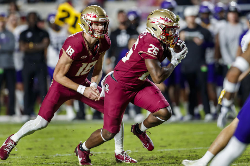 Florida State's Caziah Holmes (26) runs for a touchdown after getting a handoff from Tate Rodemaker during the first half of the team's NCAA college football game against North Alabama, Saturday, Nov. 18, 2023, in Tallahassee, Fla. (AP Photo/Colin Hackley)