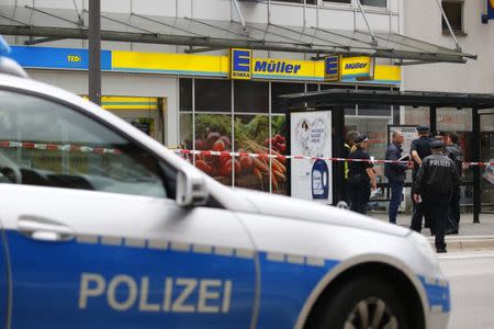 Security forces are seen after a knife attack in a supermarket in Hamburg, Germany, July 28, 2017. REUTERS/Morris Mac Matzen