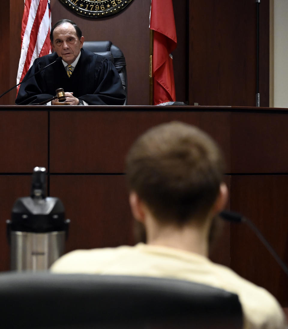 Criminal Court Judge Dee David Gay talks to Michael Cummins about the sentencing at the Sumner County Justice Center on Wednesday, Aug. 16, 2023, in Gallatin Tenn. Cummins who killed eight people in rural Westmoreland over several days in April 2019, has pleaded guilty to eight counts of first-degree murder in exchange for a sentence of life without parole. (Mark Zaleski/The Tennessean via AP, Pool)