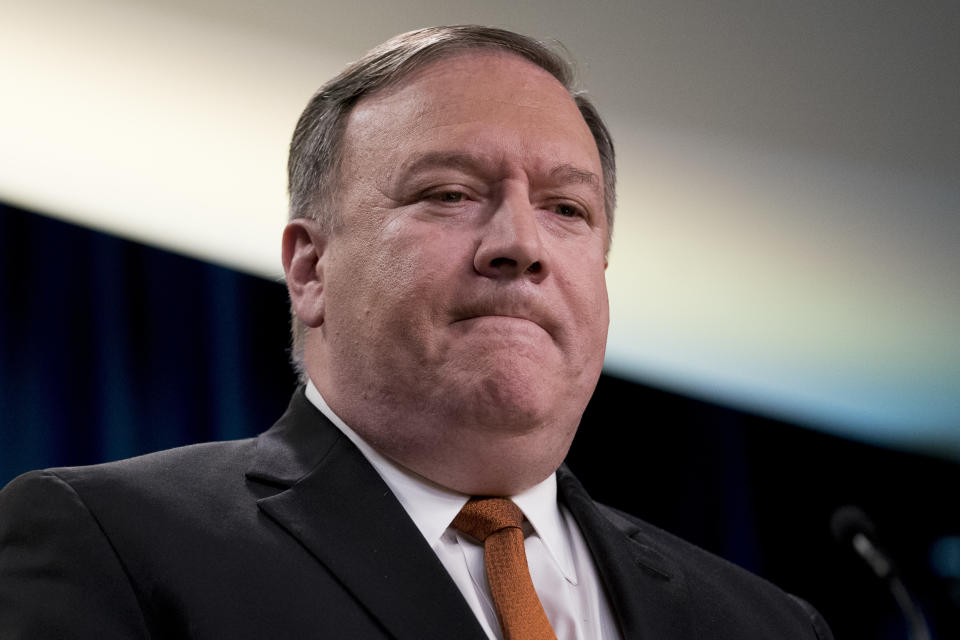 Secretary of State Mike Pompeo pauses as he speaks at a news conference in the press briefing room at the State Department in Washington, Friday, Sept. 14, 2018, in Washington. Pompeo says his Obama-era predecessor John Kerry has been 'actively undermining' U.S. policy on Iran. (AP Photo/Andrew Harnik)