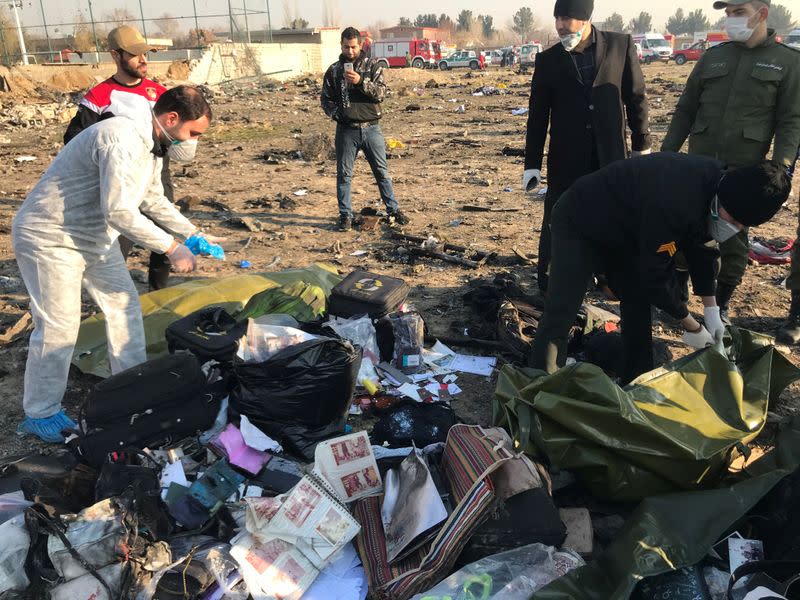 Passengers' belongings are seen after the Ukraine International Airlines plane crashed after take-off from Iran's Imam Khomeini airport, on the outskirts of Tehran