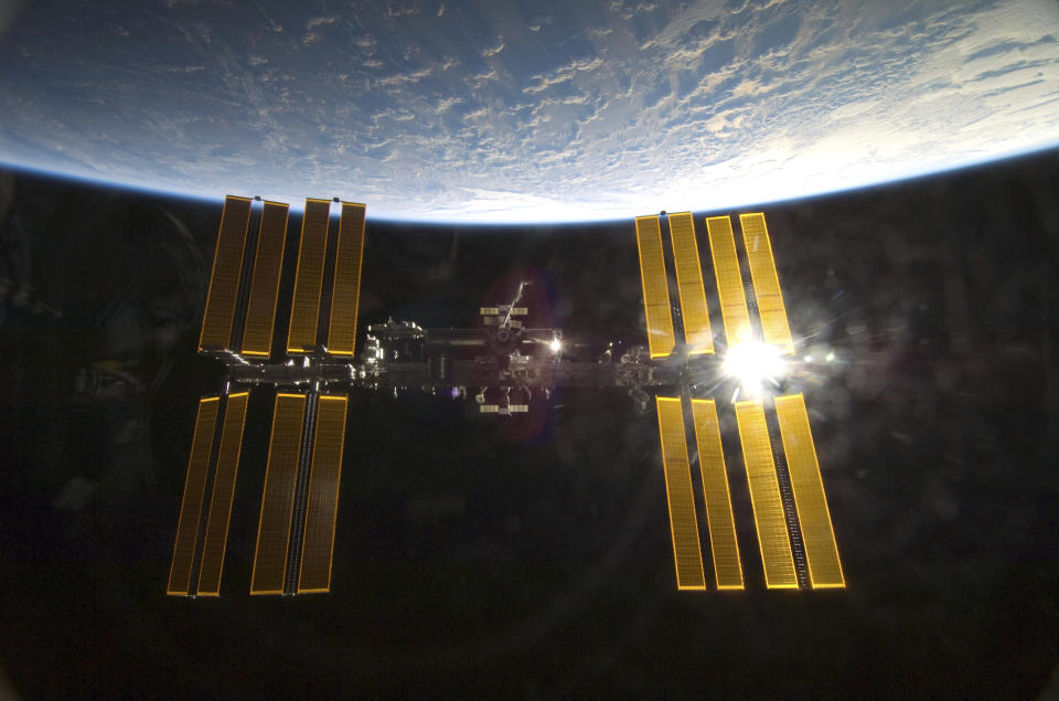 With the Earth in the background, the International Space Station is featured in this image photographed by an STS-130 crew member from aboard the Space Shuttle Endeavour in this photo released by NASA and taken February 9, 2010. REUTERS/NASA Handout