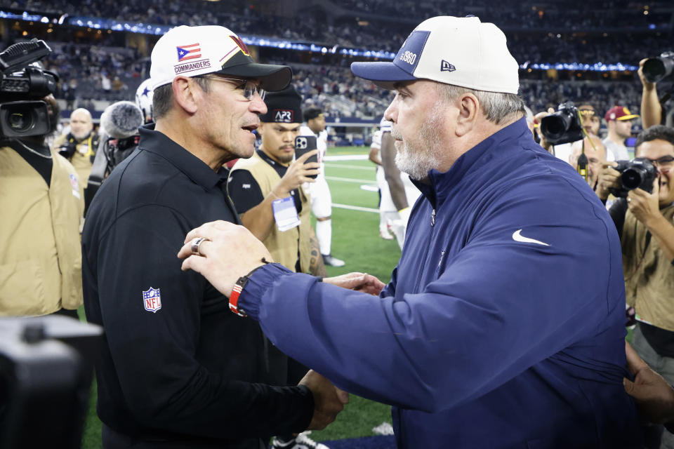 Washington Commanders head coach Ron Rivera, left, talks with Dallas Cowboys head coach Mike McCarthy after an NFL football game Thursday, Nov. 23, 2023, in Arlington, Texas. (AP Photo/Michael Ainsworth)