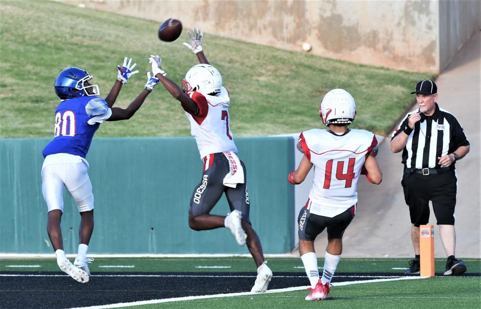 Cooper's Jaylen Parker, left. hauls in a TD pass from Chris Warren as an Odessa High player defends during a scrimmage on Thursday at Shotwell Stadium.