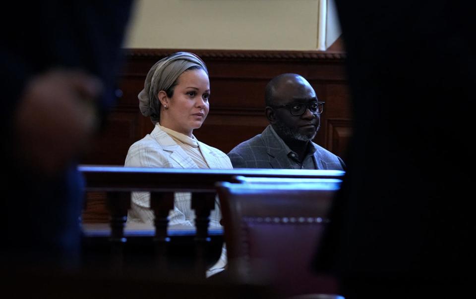 Natacha Legein, with her husband and business partner, Anthony Adagboyi, listens as Judge Richard D. Raspallo sentences two men on Monday for a 2020 street-racing crash that nearly killed Legein.