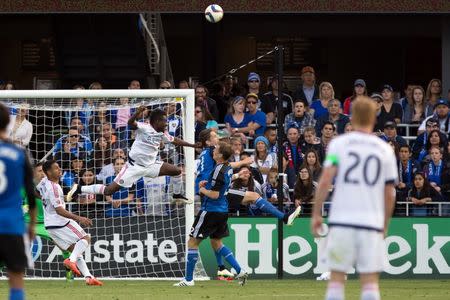 Chicago Fire forward David Accam (11) extends for the ball against San Jose Earthquakes defender Clarence Goodson (21) and defender Ty Harden (2) during the second half at Avaya Stadium. The San Jose Earthquakes defeated the Chicago Fire 2-1. Mandatory Credit: Kelley L Cox-USA TODAY Sports