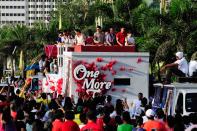 The casts of the MMFF 2012 entry "One More Try" are seen as their float makes its way through the crowd at the 2012 Metro Manila Film Festival Parade of Stars on 23 December 2012. (L-R) Angel Locsin, Dingdong Dantes and Zanjoe Marudo. (Angela Galia/NPPA Images)