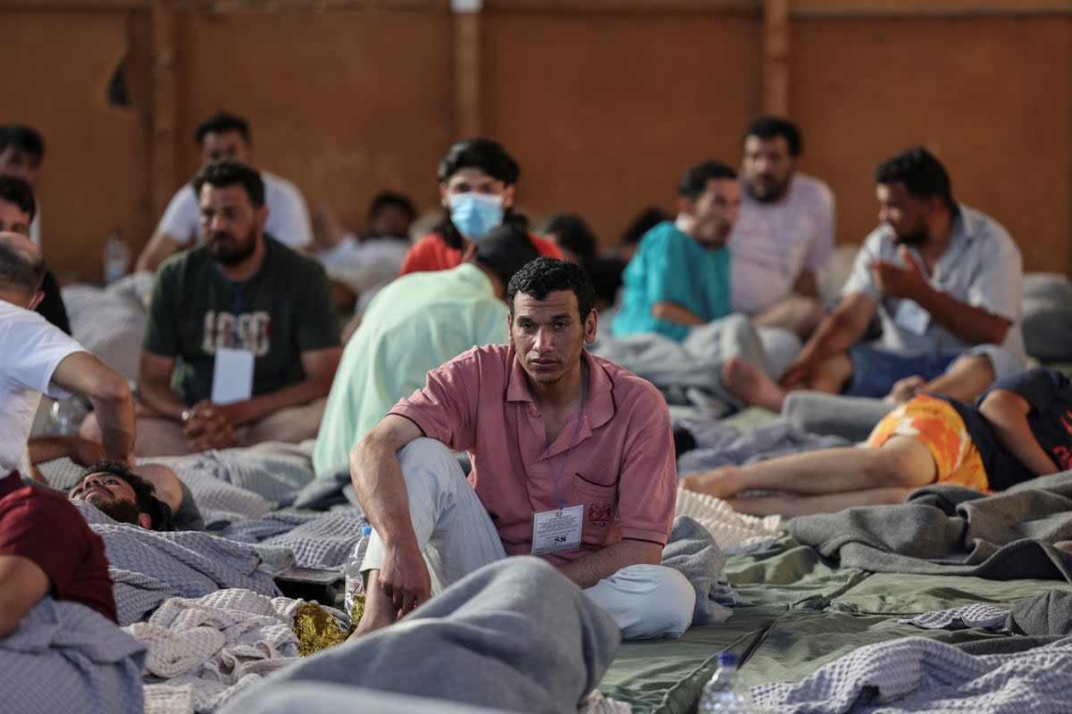 Migrants rest in a shelter in Kalamata, Greece, following their rescue from the Mediterranean (Stelios Misinas/Reuters)