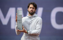 Nikoloz Basilashvili of Georgia lifts the trophy after winning against Jan-Lennard Struff of Germany at the tennis ATP final match in Munich, Germany, Sunday, May 2, 2021. (Sven Hoppe/dpa via AP)