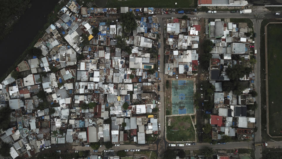 An aerial view of the “Puerta 8” neighborhood, a suburb north of Buenos Aires, Argentina, Thursday, Feb. 3, 2022, where police say adulterated cocaine was sold that killed 20 people and seriously sickened dozens. (AP Photo/Rodrigo Abd)
