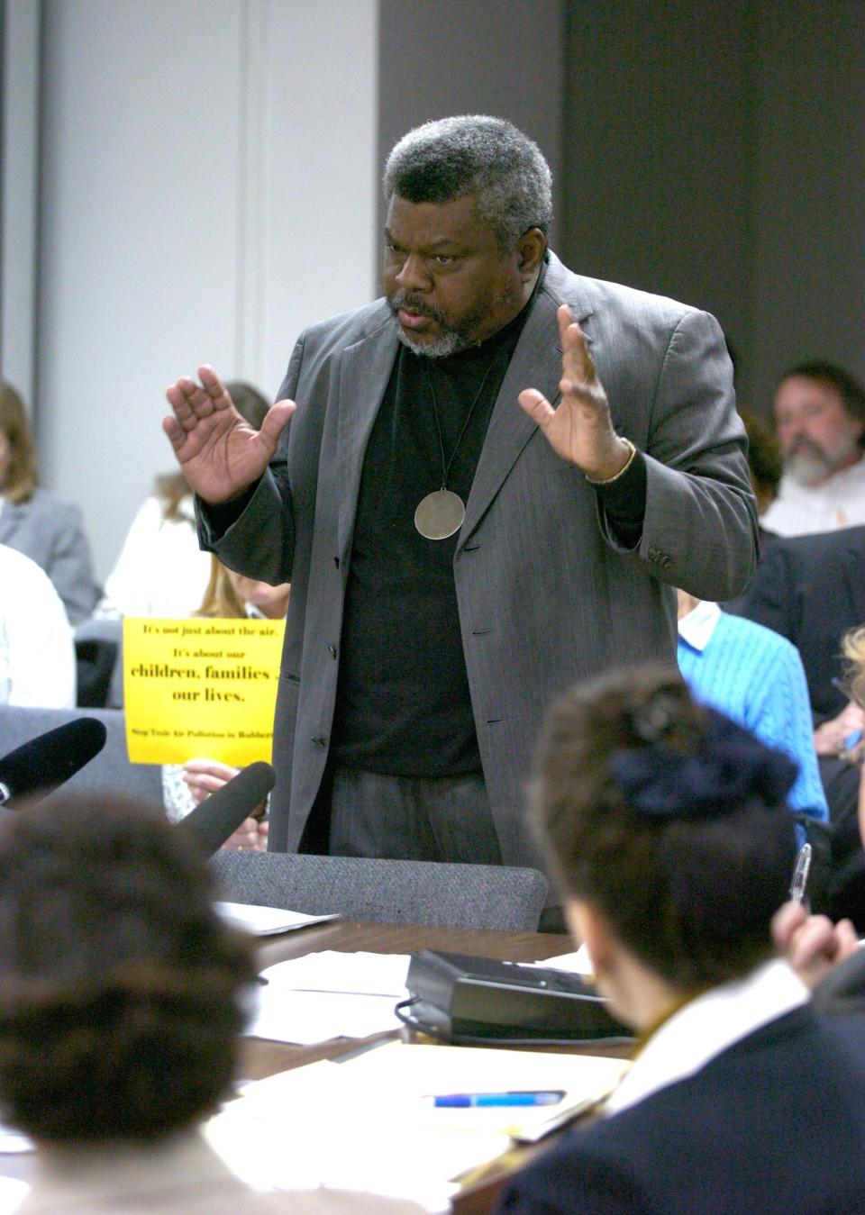 -

-Text: Photo by David Harpe, SPECIAL TO THE COURIER-JOURNAL March 17th, 2004 The Reverend Louis Coleman of the Justice Resource Center speaks before the Air Pollution Control Board.