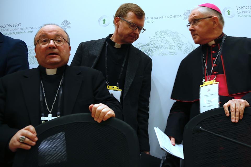 From left, Malta's Archbishop Charles Scicluna, theologian Hans Zollner, one of the founding members of the Pontifical Commission for the Protection of Minors, and Brisbane's Archbishop Mark Coleridge arrive to a media briefing in Rome, Thursday, Feb. 21, 2019, after the opening session of a four-day sex abuse summit called by Pope Francis. The gathering of church leaders from around the globe is taking place amid intense scrutiny of the Catholic Church's record after new allegations of abuse and cover-up last year sparked a credibility crisis for the hierarchy. (AP Photo/Domenico Stinellis)