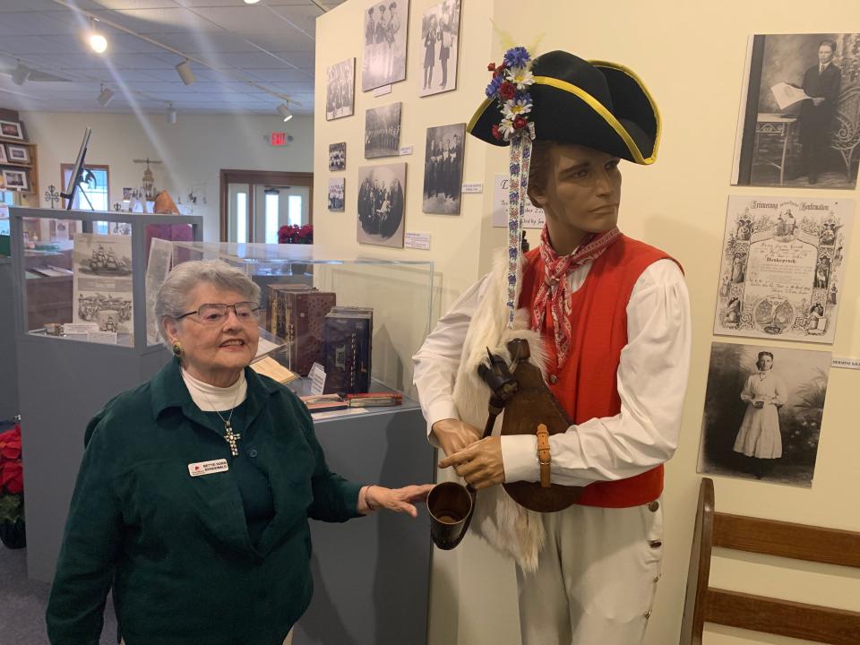 Tour guide Bettie Horn Bendewald explains the Wendish musical instrument known as a dudelsack. She's never heard one played, but her mother used to say when she whined and cried as a child, "You sound just like a dudelsack."