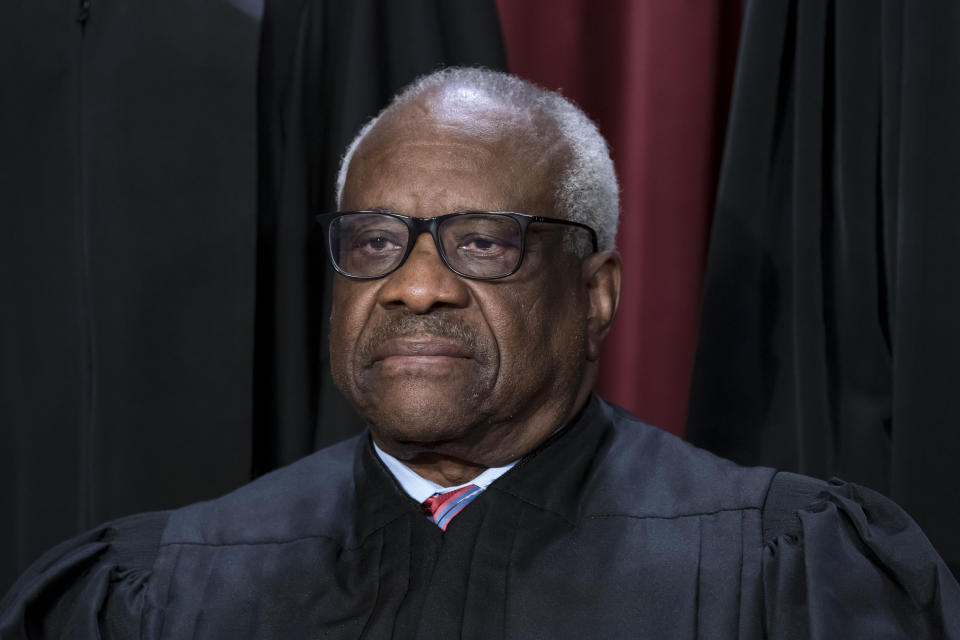 FILE - Associate Justice Clarence Thomas joins other members of the Supreme Court as they pose for a new group portrait, at the Supreme Court building in Washington, Oct. 7, 2022. (AP Photo/J. Scott Applewhite, File)