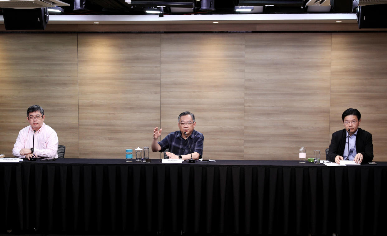 From left to right: Ministry of Health's director of medical services Kenneth Mak, and multi-ministry taskforce chairmen Gan Kim Yong and Lawrence Wong at a weekly virtual press conference on Tuesday (7 July). (Photo: Ministry of Communications and Information)