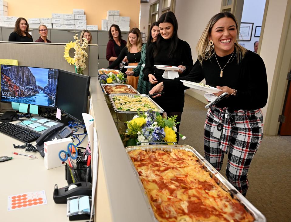 Head account clerk Christina Sanchez makes her way through the line during a staff appreciation luncheon Sept. 30 at Worcester Central District Court.